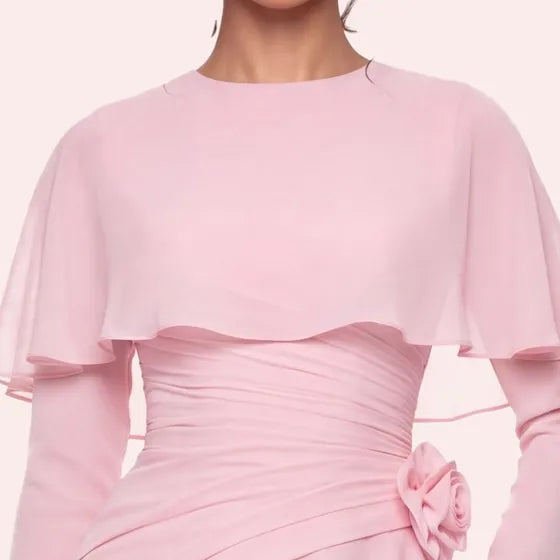 The chiffon cape over the shoulders